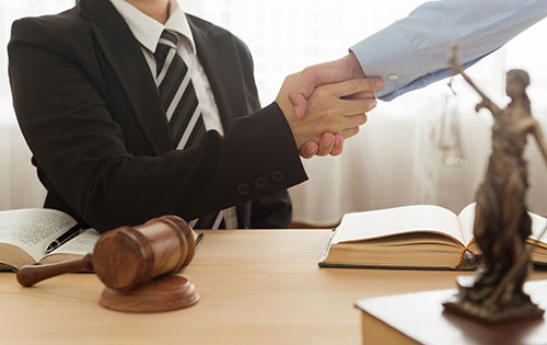 SEC settlement concept, a lawyer shaking hands